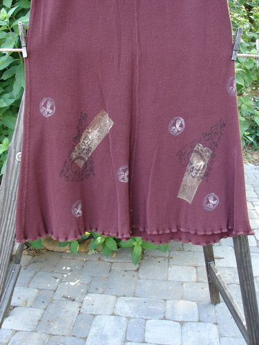 1996 Thermal Swirl Skirt Moon Cayenne Size 2: A red skirt with a pattern on it, hanging on a clothes rack.