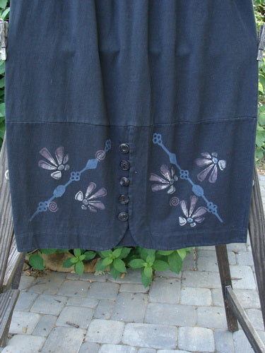 1997 NWT Indra Skirt Abstract Floral Obsidian Size 1: A skirt with a flower design, double paneled lower, and colorful chiseled buttons.