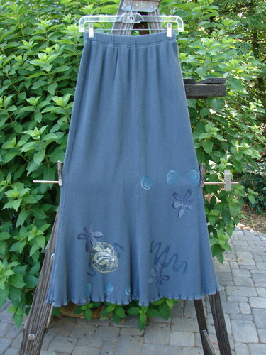 1996 Thermal Swirl Skirt Flower Mirror Size 0: A blue skirt with a flower design on it, featuring a full elastic waistline and lettuce edging. Abstract theme paint and vertical sectional panels create a mermaid-like flair.