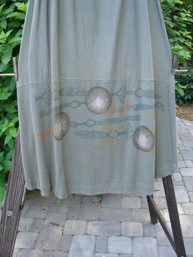 A grey shirt with a design on it, part of the 2000 Cotton Hemp Shade Skirt Biology Loden Size 2 from Bluefishfinder.com.