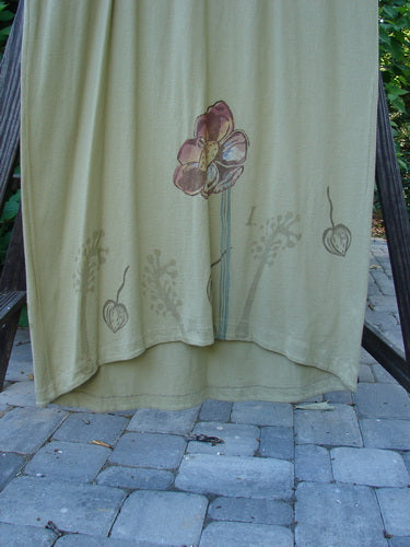 1998 Botanicals Calla Dress Giant Floral Seed Size 2: A towel on a rack with a white flower drawing and a close-up of a stone floor.