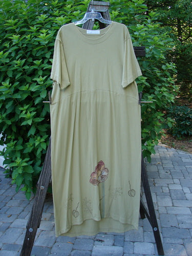 1998 Botanicals Calla Dress: A green dress with a flower on it. Softly folded neckline, drop shoulders, slightly pegged shape, and a sweet scooped hemline. Organic cotton, size 2.