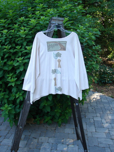 1993 Resort Blueline Top with a wood post design. White shirt on a rack. Vintage Blue Fish Clothing. Size 1.