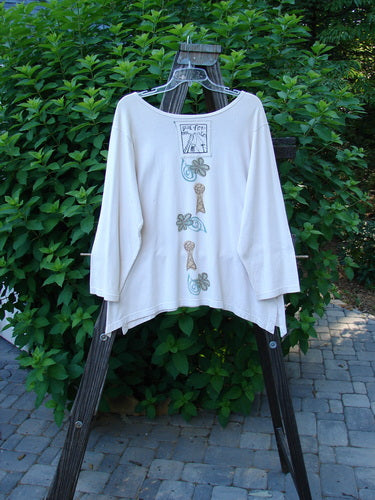 1993 Resort Blueline Top: A white shirt on a wooden rack. Features include a wider boatneck neckline, drop shoulders, and a varying hemline. Size 1.