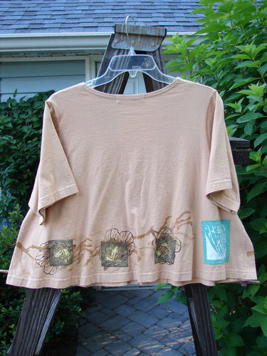 1997 Cove Jacket Sea Life Driftwood Size 1: A tan shirt with a sea life design on it, featuring a flared and cropped A-line shape, V-shaped neckline, and swing style. Includes a porcelain closure, fish patch, and painted pockets.