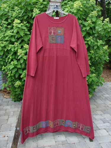 Barclay Hemp Cotton Curved A Line Dress Tree of Life Hollyberry Size 2: An extra long red dress with a pattern of the Tree of Life theme along the hem. Cozy sleeves and a wide A-line shape create a unique and comfortable look.