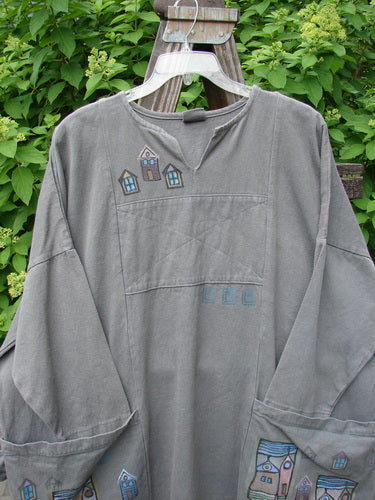 A grey tunic top with a rectangular patch, oversized pockets, and drop shoulders. Made from heavy hemp twill. Size 2.