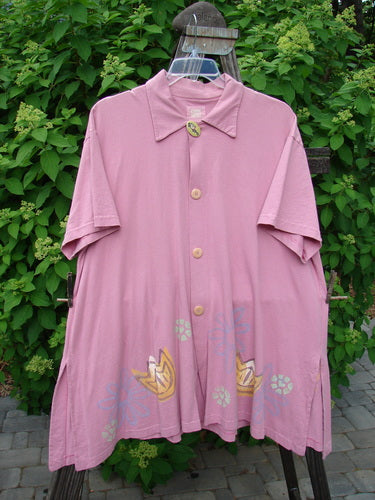 1999 Tarragon Top Tulip Daisy Raspberry Size 2: A pink shirt with a flower design, deep vented sides, and a pleated and gathered back.
