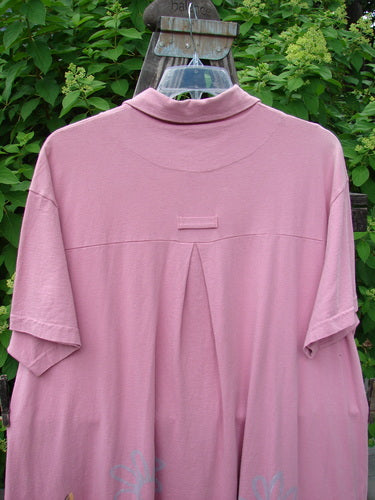 1999 Tarragon Top Tulip Daisy Raspberry Size 2: A pink shirt featuring a deep vented sides, pleated and gathered back, and a tulip and daisy theme paint.