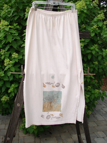 1994 Panel Skirt Daisy Lane Tea Dye Size 2: A white skirt on a rack with a wood post in the background.