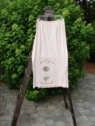 Image alt text: "1994 Panel Skirt Daisy Lane Tea Dye Size 2: White skirt with a painted daisy design and curved side buttons."