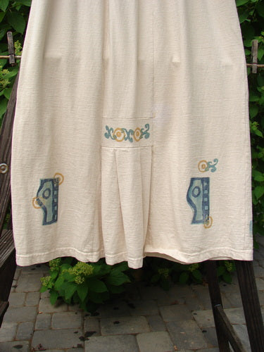 1995 Kick Skirt Resort Travel Champagne Size 2: A white pants with blue and yellow designs on a rack, close up of a plant, and a close up of a wooden post.
