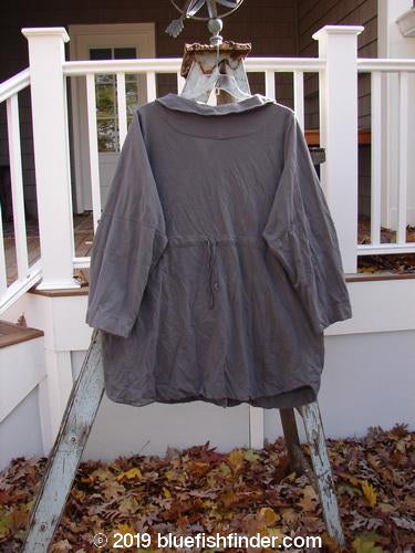 Barclay Cotton Lycra Zip Draw Back Jacket Side Art Dusk Grey Size 1: a grey jacket with sailor-like collar, full zip front, and drawcord back on a wooden ladder.