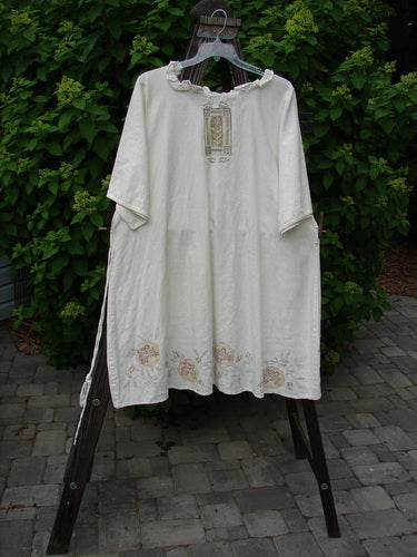 Image alt text: Barclay Linen Duet Sunrise Dress with fern circle flower design, size 2, on clothes rack