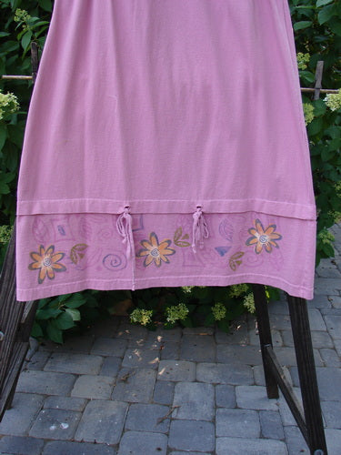1999 Basket Skirt with Continuous Daisy design in Raspberry. Made from Medium Weight Organic Cotton. A-line flair, elastic waistband, deep side pockets. Length: 38". Size 0.