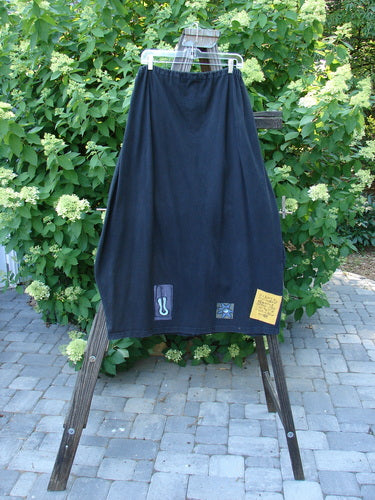 A 1996 Destination Skirt from the Summer Collection in Black. Features include a drawstring waist, painted pockets, and a signature Blue Fish patch. Flare and pockets make this skirt a standout piece.