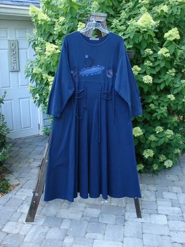1997 Caryatid Dress Abstract Window Pane Size 2: A vintage blue dress on a clothes rack. Flattering silhouette with adjustable laces and a sweeping, heavy lower. Bust 52-60, waist 52-60, hips 62-70. Length 56 inches.