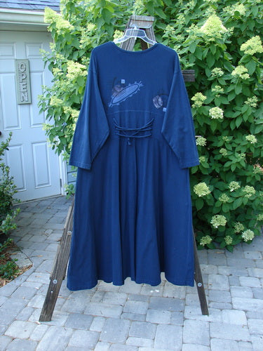 1997 Caryatid Dress Abstract Window Pane Size 2: A vintage blue dress with adjustable laces in the front and back. Made from organic cotton, it features a sweeping A-line lower and drop shoulders. Bust 52-60, waist 52-60, hips 62-70, hem circumference 140, length 56 inches.