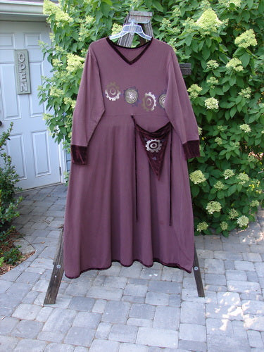 Image alt text: 1996 Velvet Ornamental Pocket Dress Spirograph Spicewood Size 1: A purple dress with a design on it, featuring a velvet-accented neck, hem, and sleeve trim.