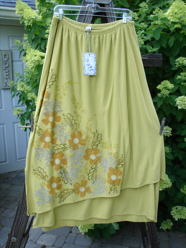 Barclay NWT Double Layer Prospect Park Skirt: Yellow skirt with flower design. Made from organic cotton. Diagonally set upper layer, vented and varying underlayer. Full elastic waistline. Generous diagonal front floral theme paint. Sectional panels. Unadorned back. Waist: 30-40. Hips: 54. Length: 38".