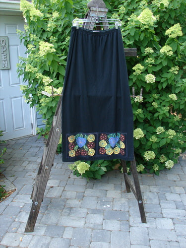 1999 Straight Skirt Bright Mosaic Florals Black Size 2 on a rack. Full elastic waistline, A-line flare, colorful mosaic florals, Blue Fish patch.