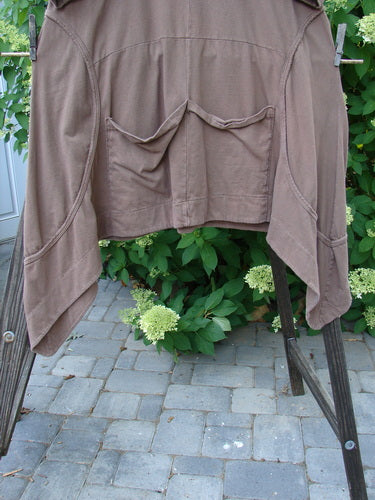 Image alt text: Barclay Double Pocket Bounce Tunic Dress on clothes rack, featuring wrap-around side seams, oversized front pockets, and a scooped hemline. Size 1, in Mushroom color.