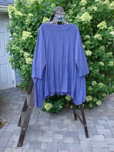 Image alt text: "Barclay Hemp Cotton Two Tier Sectional Jacket on a rack, featuring swingy side inserts, exterior stitchery, and cuff able lower sleeves."