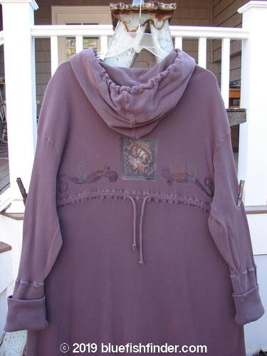 1995 Thermal West Wind Coat: Purple hooded sweatshirt on a swinger with metal accents and a picture on the wall.