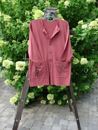 1996 Elements Everyday Jacket Primitive World Ember Size 1: A pink shirt on a swinger with buttons, rack, shorts on a wooden stand, and a close-up of a wooden post.