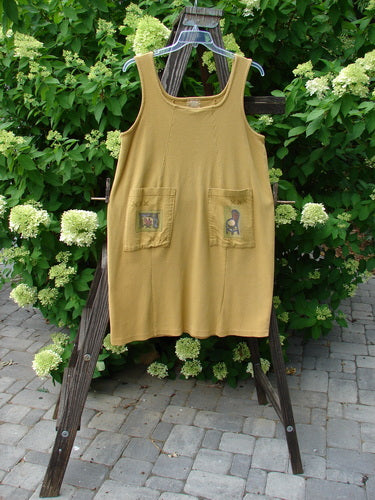 1999 Square Rib Pinafore Jumper in Gold, Size 1. Heavyweight cotton lycra rib with A-line shape, elastic tab rear, and front painted pockets. Bust 42, Waist 48, Hips 56, Length 42.