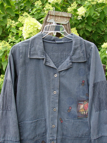 A blue jacket with patched stripe accents, featuring a full metal button front, stand-up collar, and double paneled cuffs and hemline. Size 1.