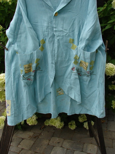 Image alt text: "1999 Breeze Jacket with cherry and teatime theme painted details, oversized drop front pockets, and a swing silhouette."