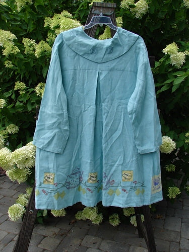 A 1999 Breeze Jacket in perfect condition. Features include a single button closure, sailor painted collar, swing panel, oversized drop front pockets, and a cherry and teatime theme. Made from light handkerchief linen. Bust 56, waist 62, hips 72, sweep 120, front length 30, back length 40 inches.