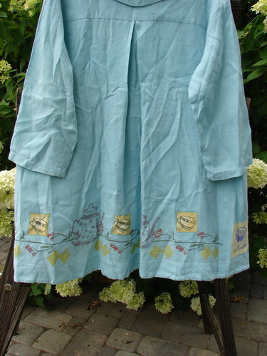 Image alt text: "1999 Breeze Jacket with cherry and teatime theme, blue dress with teapot design, Spring Collection, light smudges, handkerchief linen, sailor collar, oversized front pockets, swing hemline, blue fish patch"