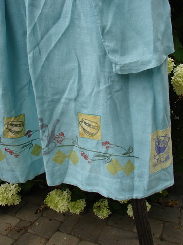 Image alt text: "1999 Breeze Jacket with cherry and teatime theme painted design, blue dress with a design on it, textile, flower"