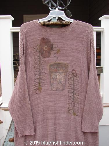 1995 Linear Tunic Top with Dual Flowerpot Paint on Twilight Rose Melange. Variegated yarns, contrasting stitchery, ribbed neckline, lower sleeve accents, dippy hemline. Bust 48, Waist 48, Hips 50, Length 36.
