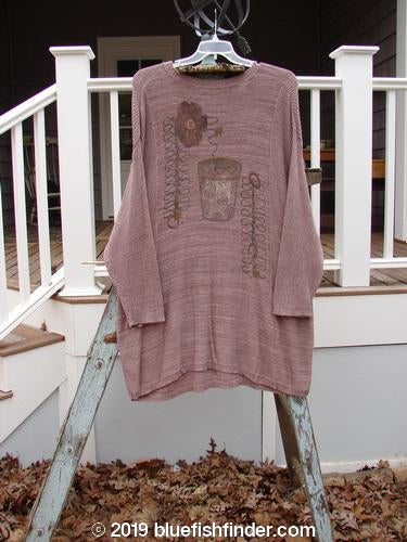 1995 Linear Tunic Top Double Flower Pot Twilight Rose Melange OSFA: A long-sleeved shirt featuring a dual flowerpot theme paint design, ribbed neckline, lower sleeve accents, and a dippy hemline. Made from a blend of cotton and rayon, this tunic is in perfect condition.