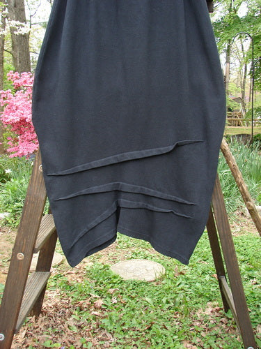 2000 Thermal Awen Skirt, black cotton with elastic waist, bell shape, textured diagonal hemline. Size 2.