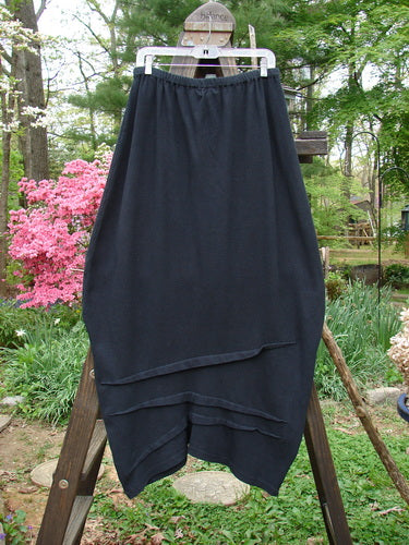 2000 Thermal Awen Skirt, black cotton with bell shape and textured diagonal hemline, size 2.